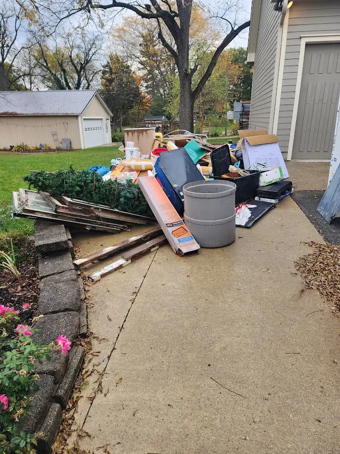 Dumpster being loaded with debris for 3 Yard Dumpster Rental in Guilford